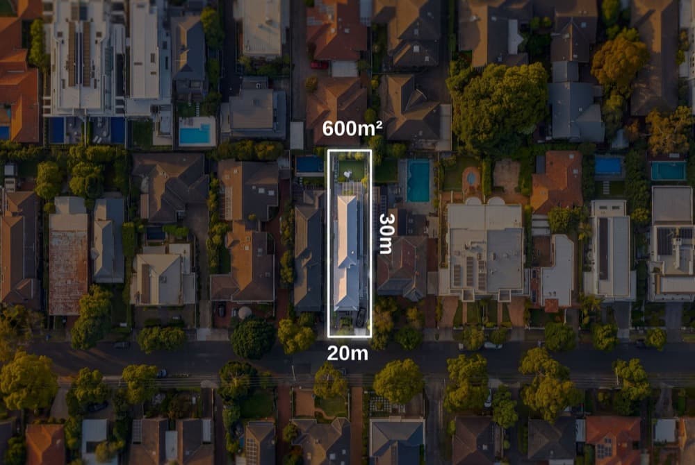 A top down aerial with the lot boundary marked and dimensioned